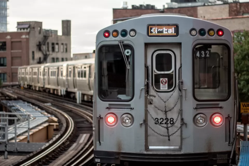 Silver train on elevated rail in Chicago, Illinois.